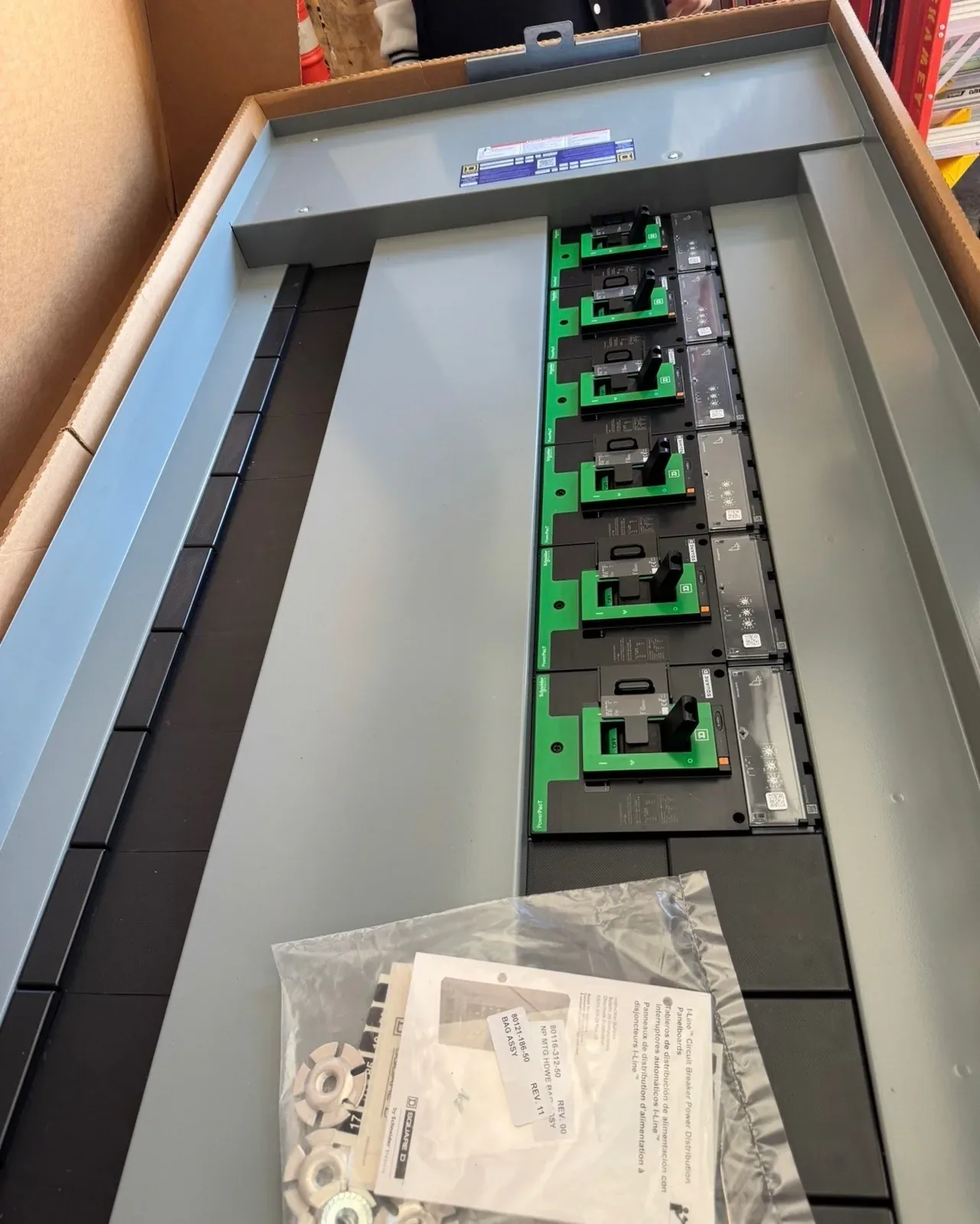 New panelboard interior with breakers, still in its box
