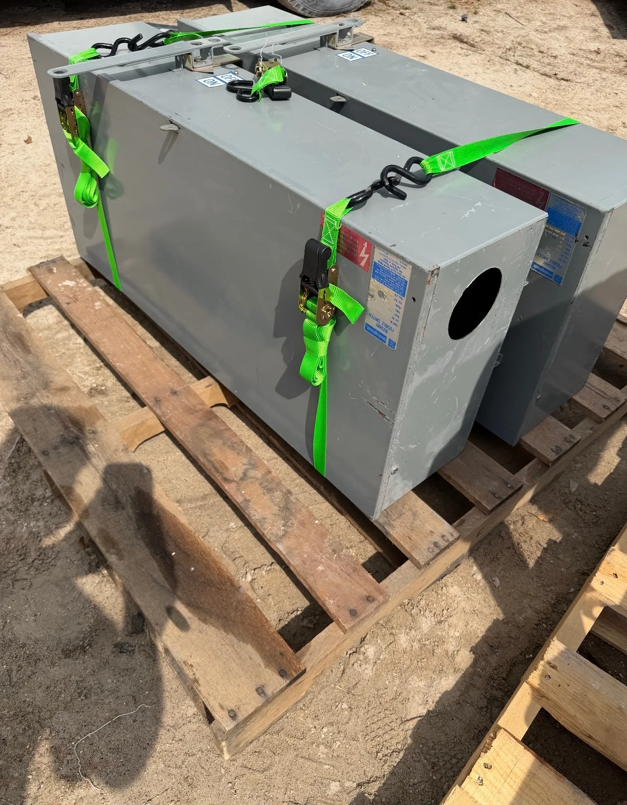Two transformers strapped to a pallet