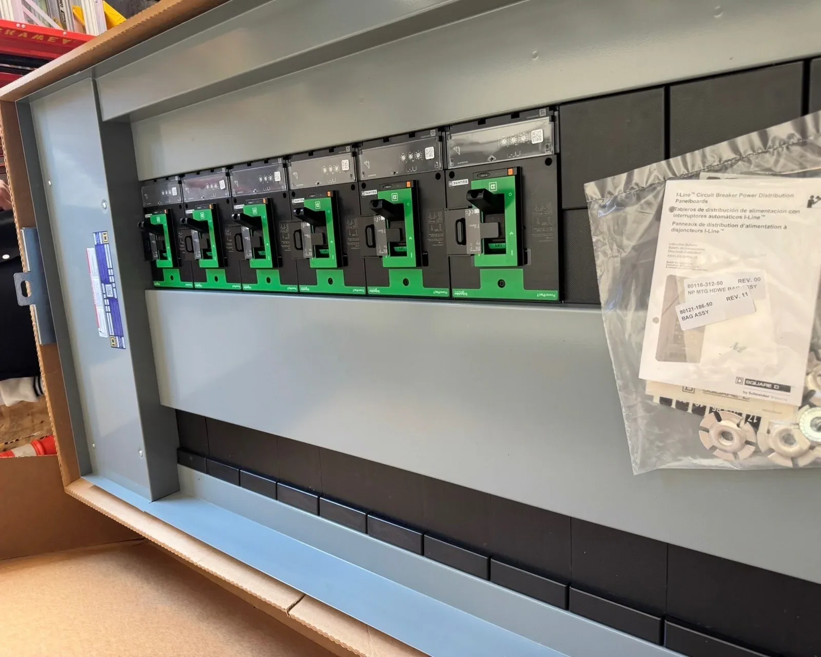 New panelboard interior with breakers, still in its box